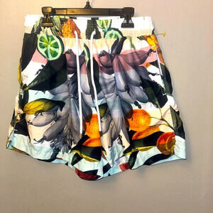 Agua Menta swim trunks - tropical fruit print black/white with pops of color